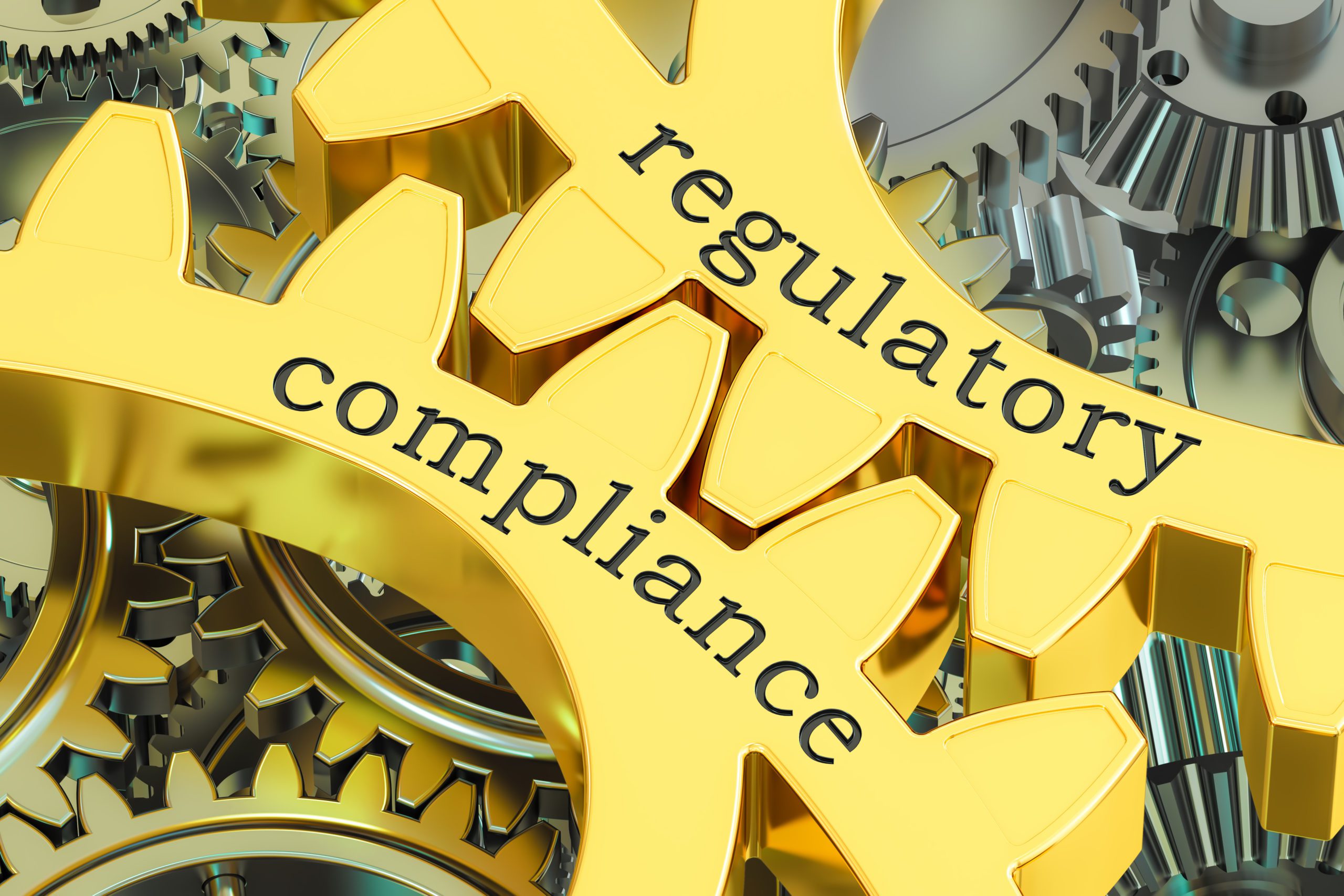 regulatory compliance concept on the gearwheels